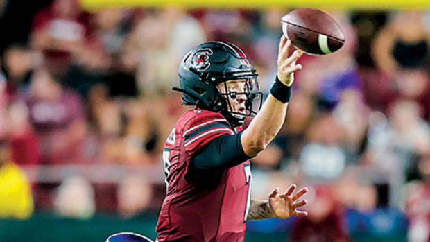 South Carolina's Spencer Rattler avoids a sack against Georgia State.